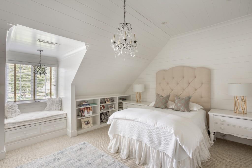 3741 Dumbarton Road Northwest Atlanta, GA 30327 - Photo 26 of 41 a spacious bedroom with a bed and a chandelier