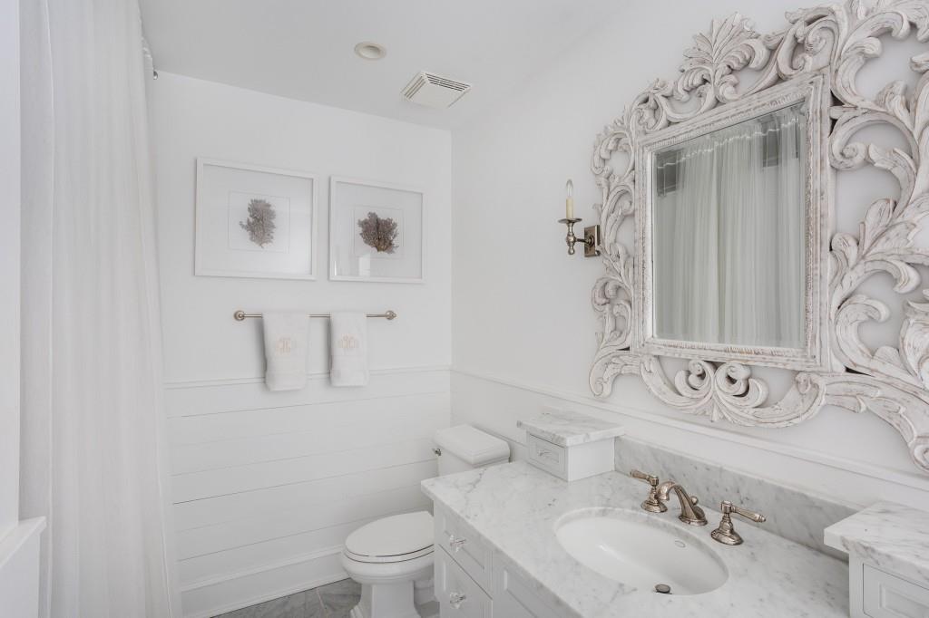 3741 Dumbarton Road Northwest Atlanta, GA 30327 - Photo 28 of 41 a bathroom with a sink and a mirror