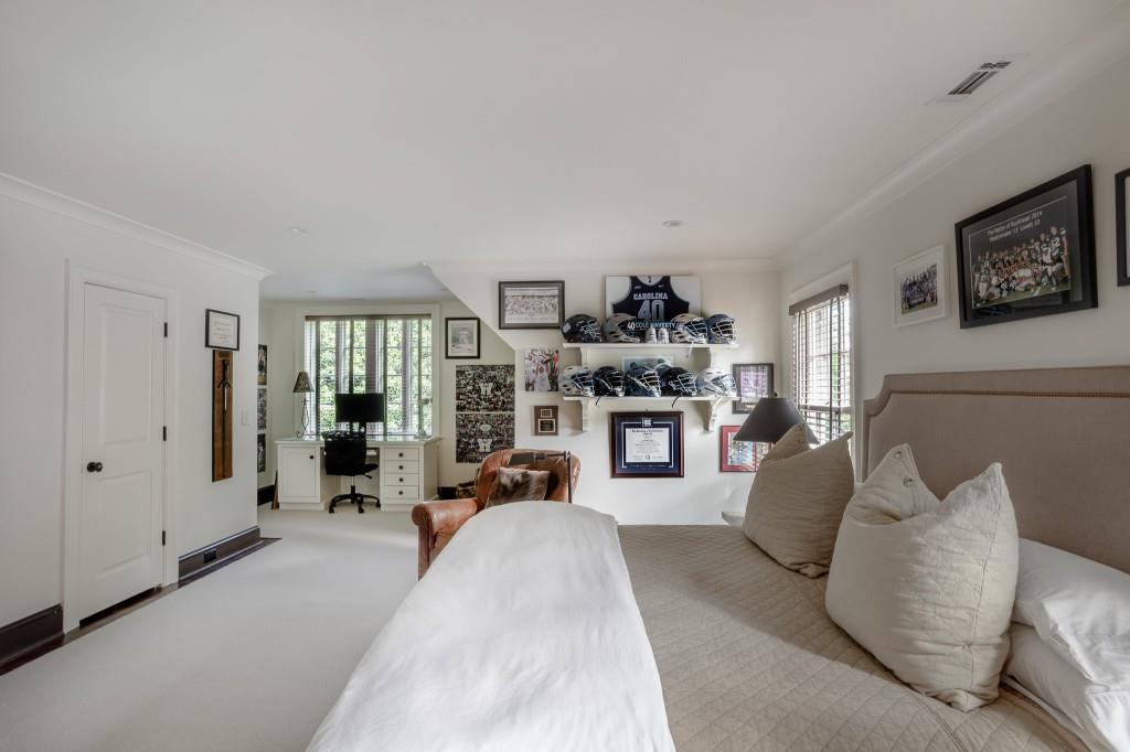 3741 Dumbarton Road Northwest Atlanta, GA 30327 - Photo 31 of 41 a living room with furniture and a fireplace