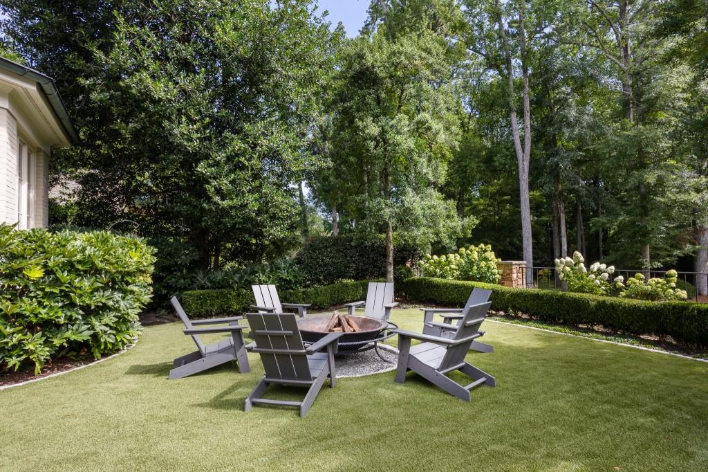 3741 Dumbarton Road Northwest Atlanta, GA 30327 - Photo 33 of 41 a view of a patio with a bench and some plants
