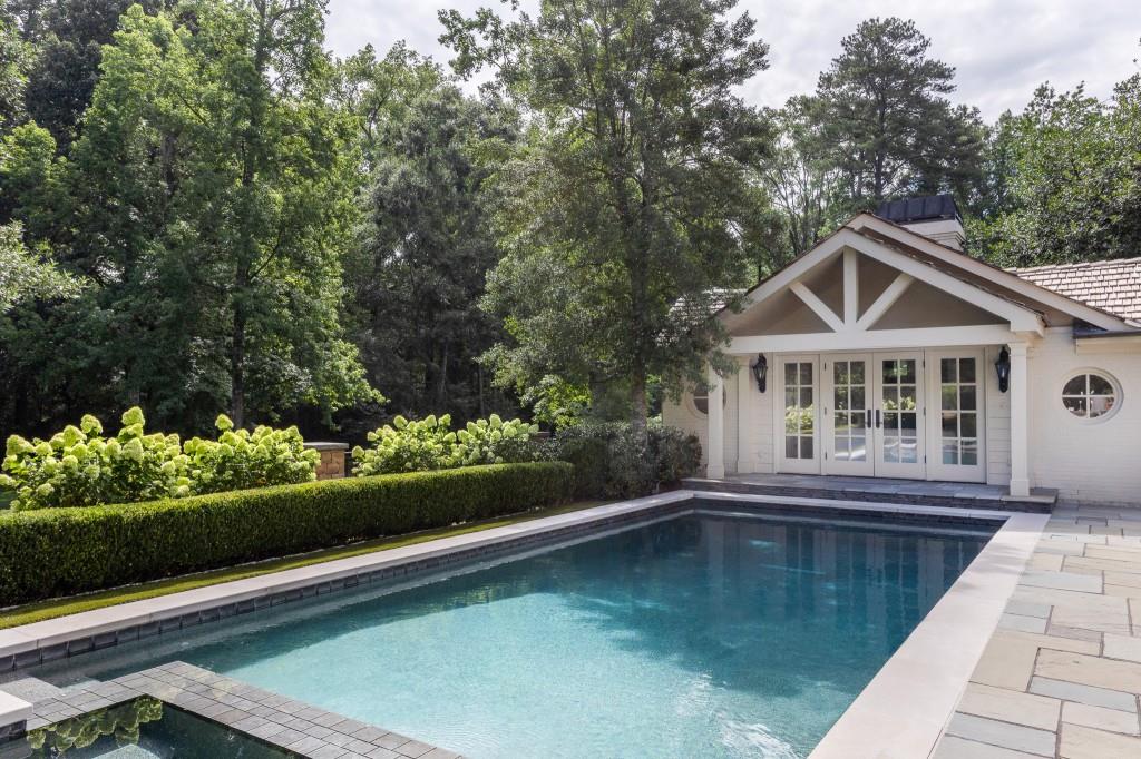 3741 Dumbarton Road Northwest Atlanta, GA 30327 - Photo 35 of 41 a view of a house with swimming pool next to a yard