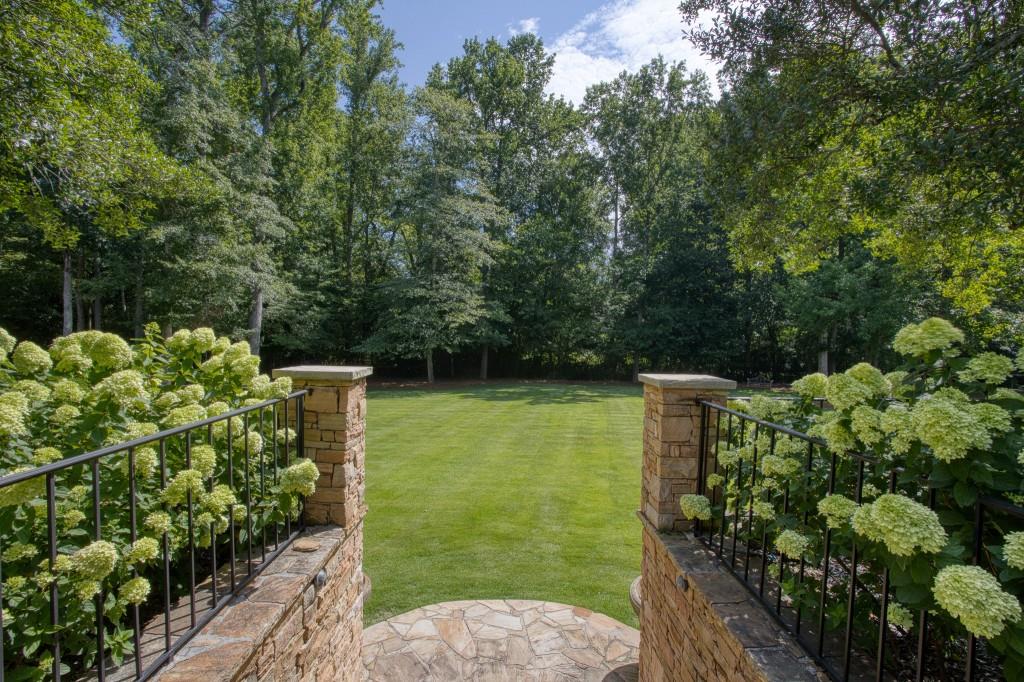 3741 Dumbarton Road Northwest Atlanta, GA 30327 - Photo 37 of 41 a backyard of a house with lots of green space