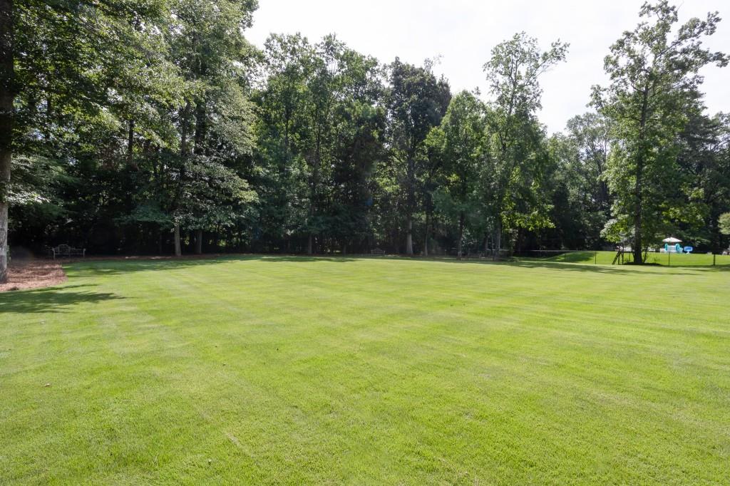 3741 Dumbarton Road Northwest Atlanta, GA 30327 - Photo 38 of 41 a view of outdoor space with deck and trees