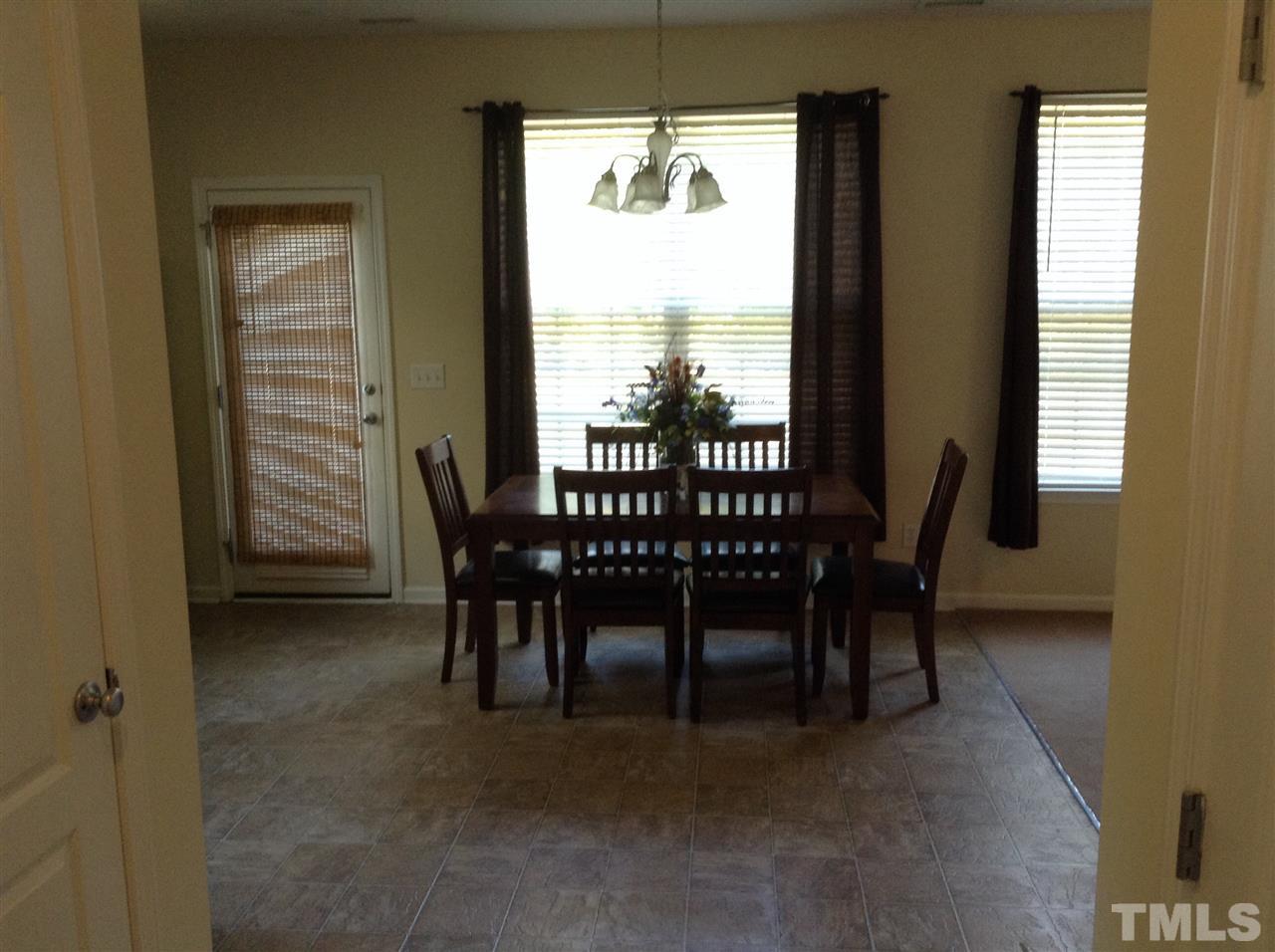 2766 Windchase Drive Raleigh, NC 27610 - Photo 3 of 14 a view of a dining room with furniture window and outside view