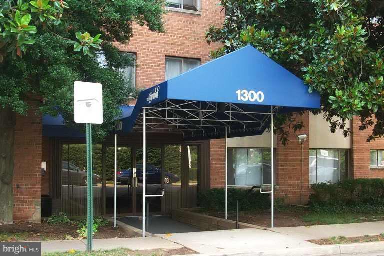 1300 South Arlington Ridge Road, Unit 614 Arlington, VA 22202 - Photo 1 of 1 a table and chairs in front of a house