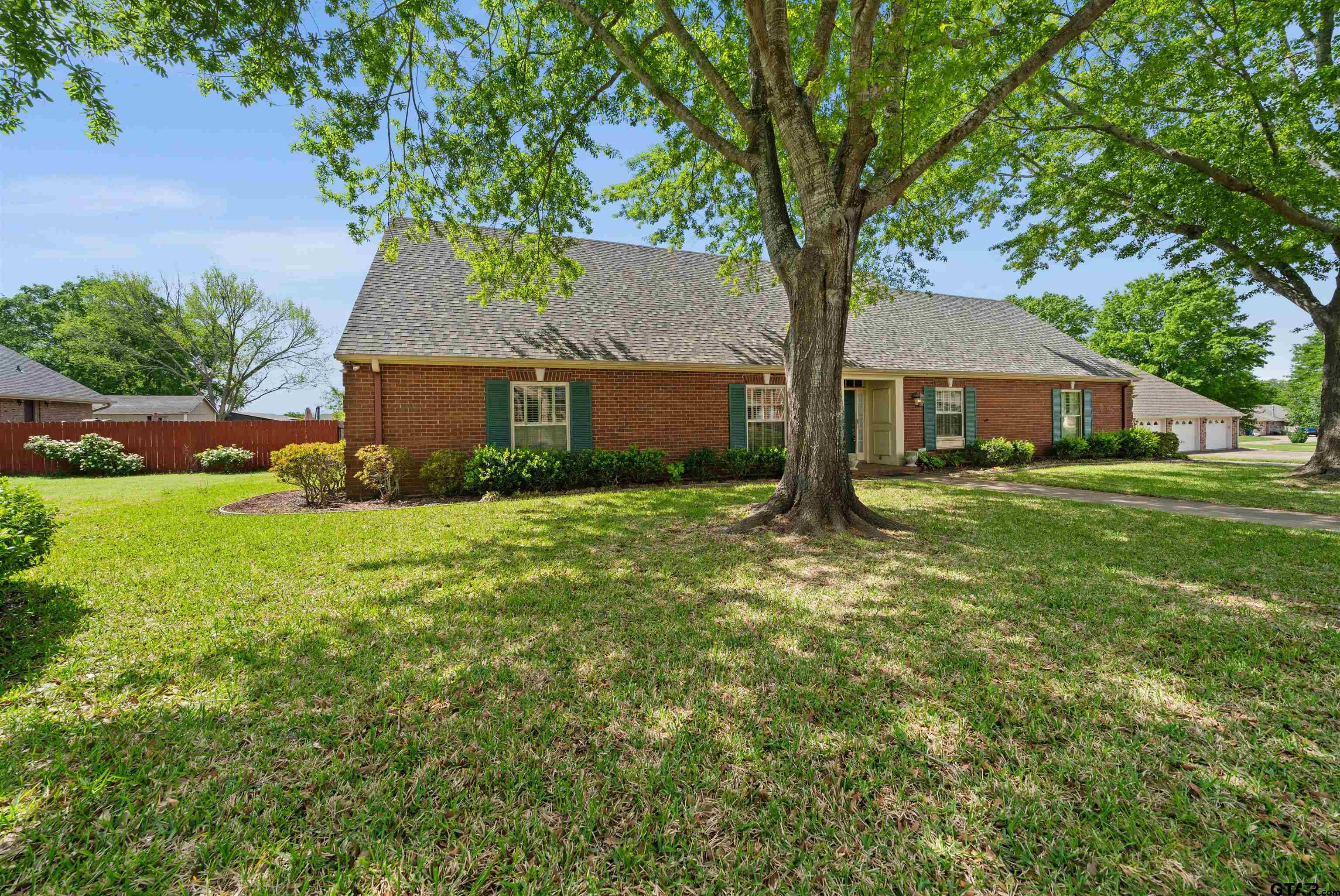 2103 Baylor Street Jacksonville, TX 75766 - Photo 2 of 45 a front view of house with yard and green space