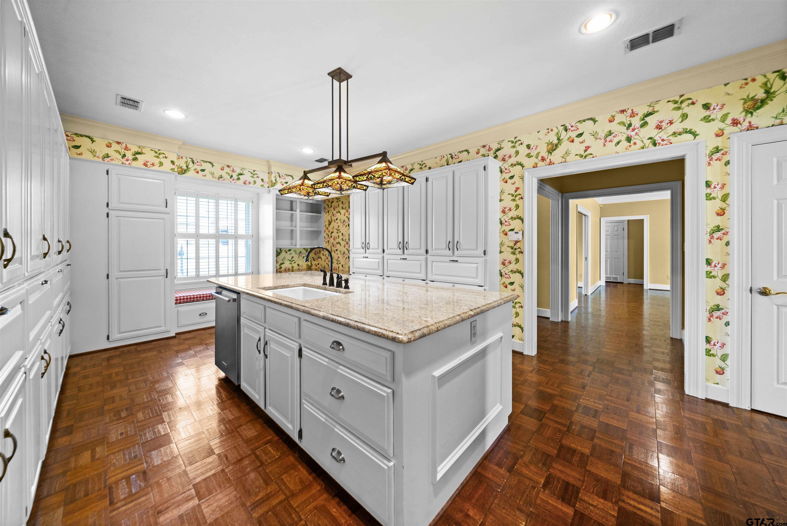 2103 Baylor Street Jacksonville, TX 75766 - Photo 24 of 45 a kitchen with stainless steel appliances granite countertop a stove and a sink