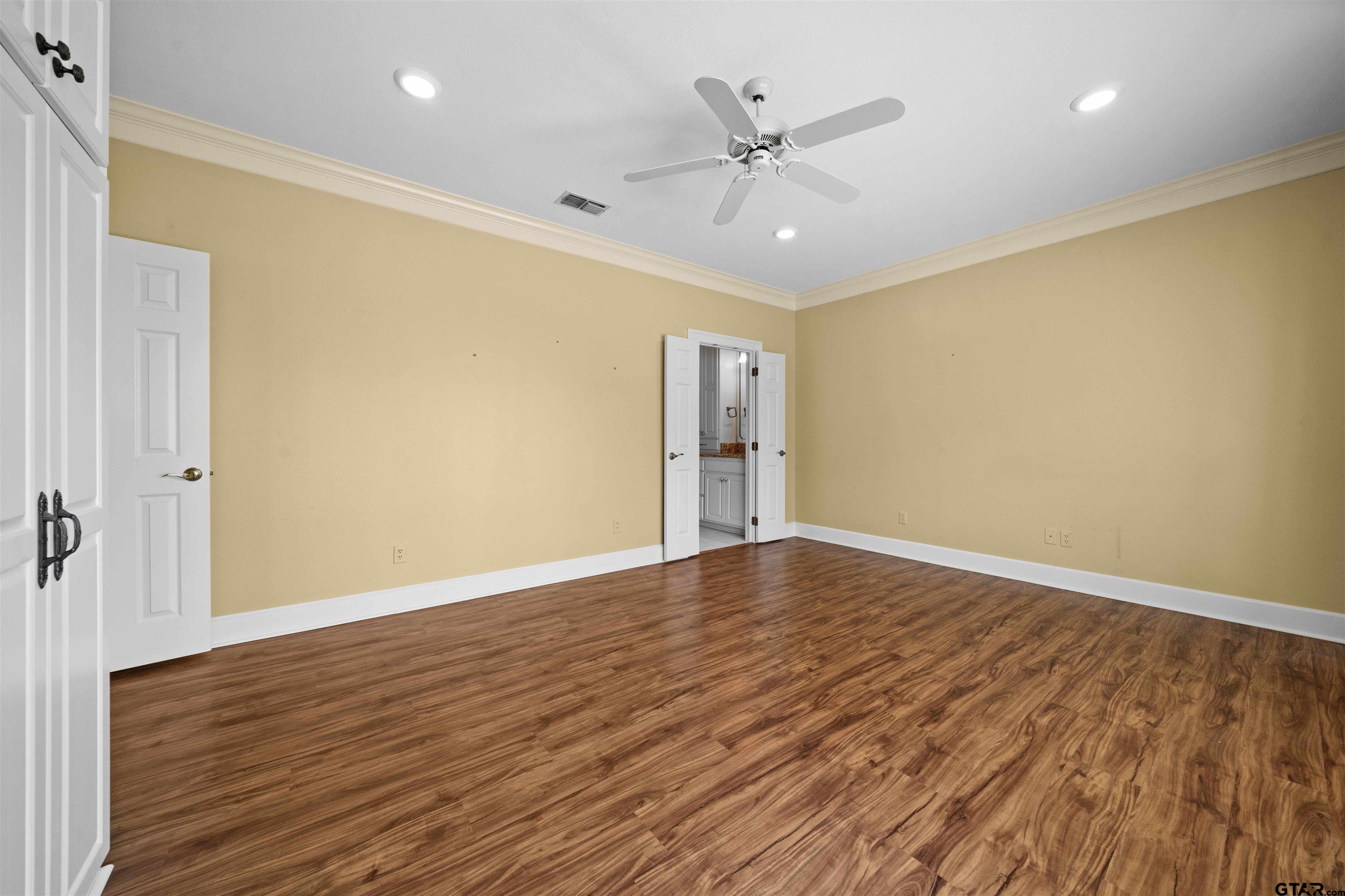 2103 Baylor Street Jacksonville, TX 75766 - Photo 29 of 45 wooden floor in an empty room with a window