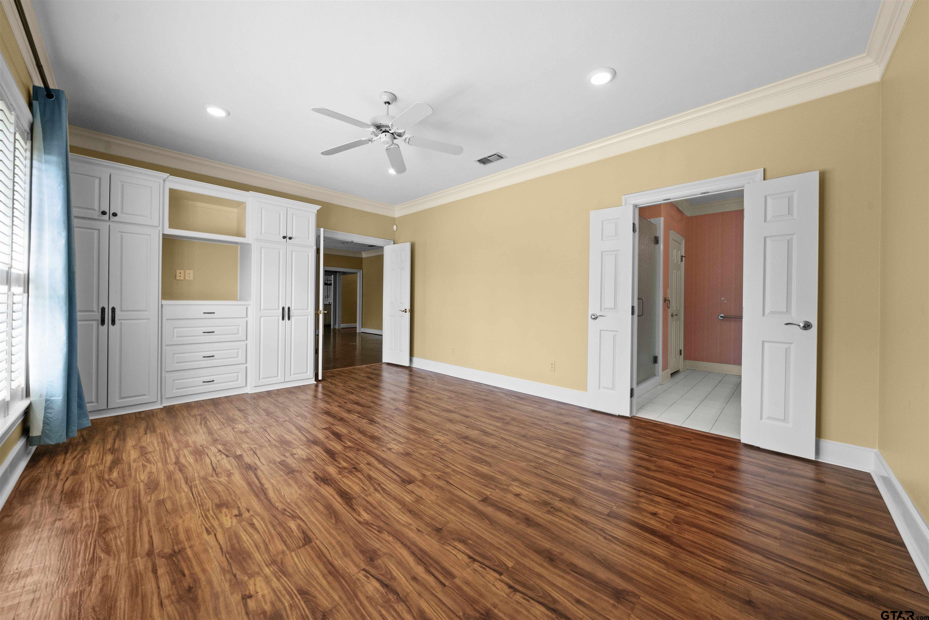 2103 Baylor Street Jacksonville, TX 75766 - Photo 31 of 45 wooden floor in an empty room with a window