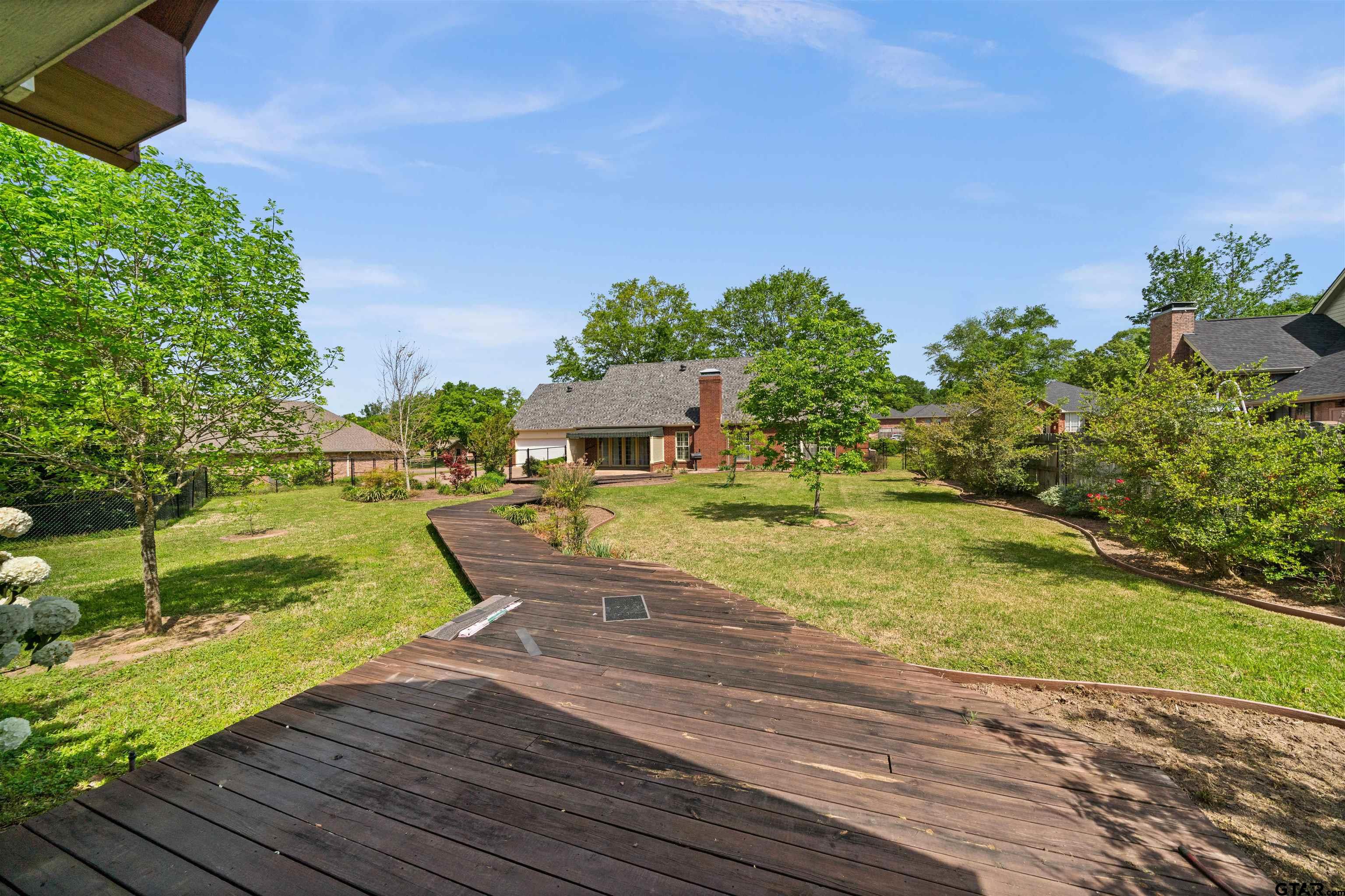 2103 Baylor Street Jacksonville, TX 75766 - Photo 40 of 45 a view of a house with a yard