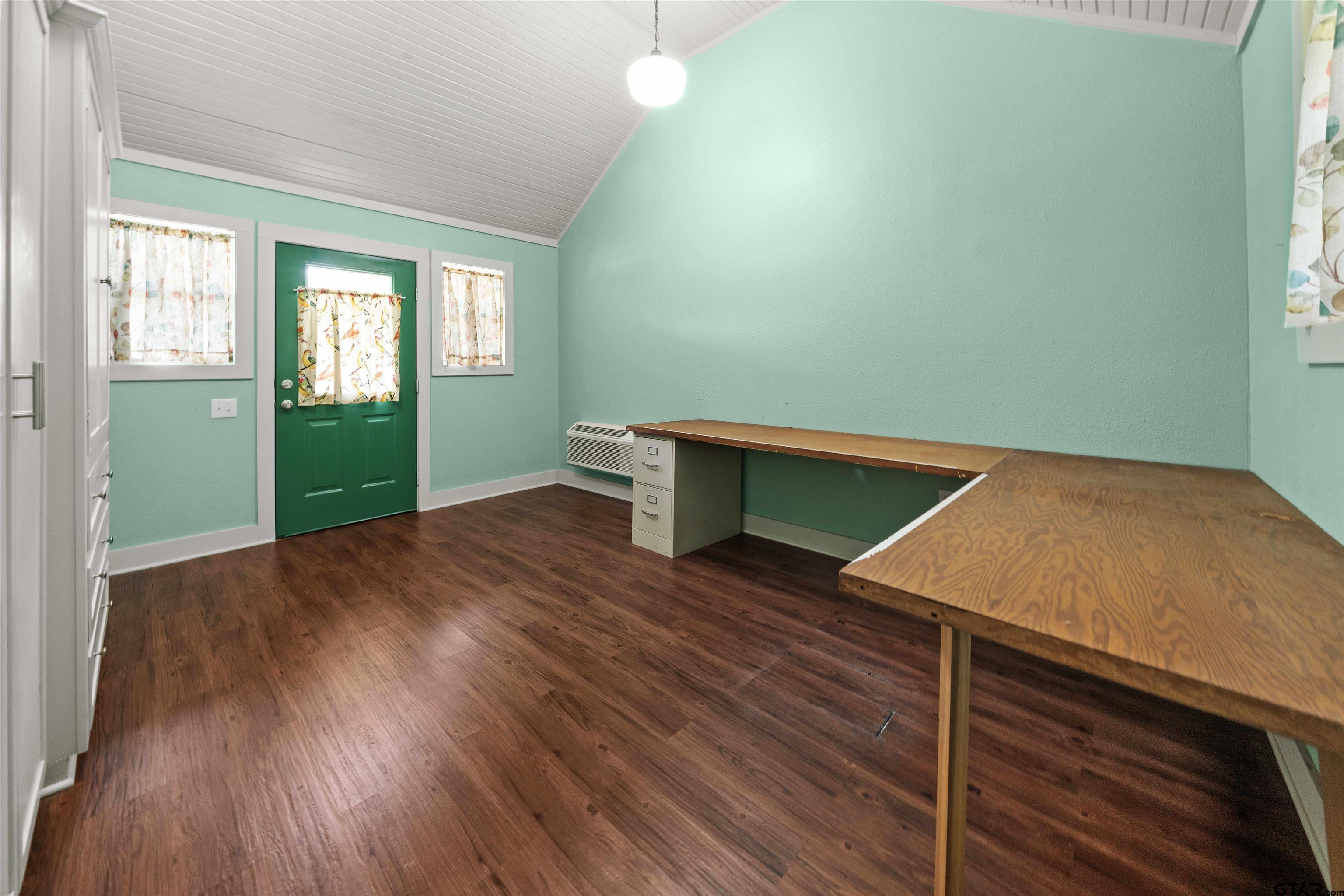 2103 Baylor Street Jacksonville, TX 75766 - Photo 42 of 45 a room with wooden floor and window