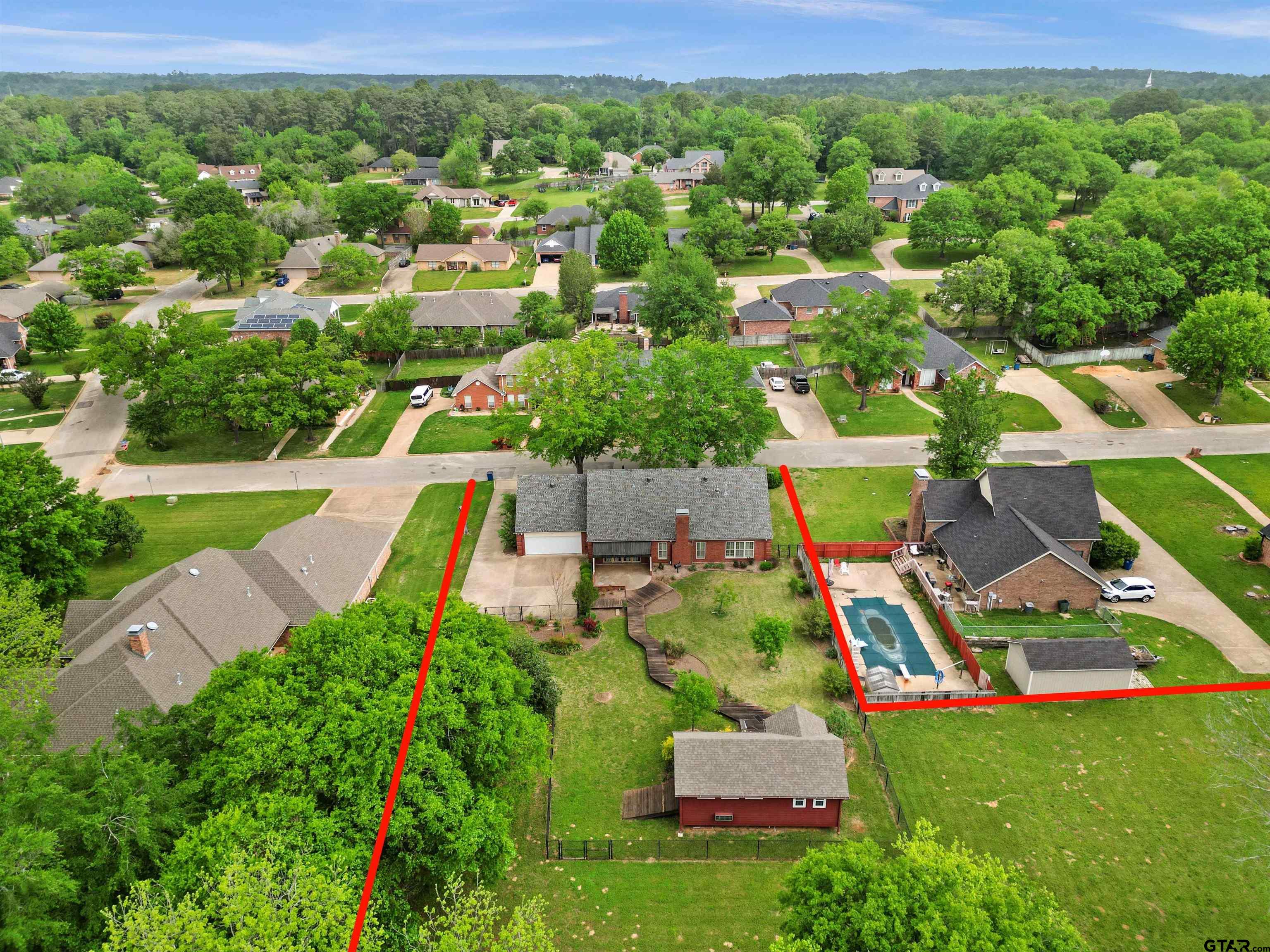 2103 Baylor Street Jacksonville, TX 75766 - Photo 44 of 45 an aerial view of residential houses with outdoor space and trees