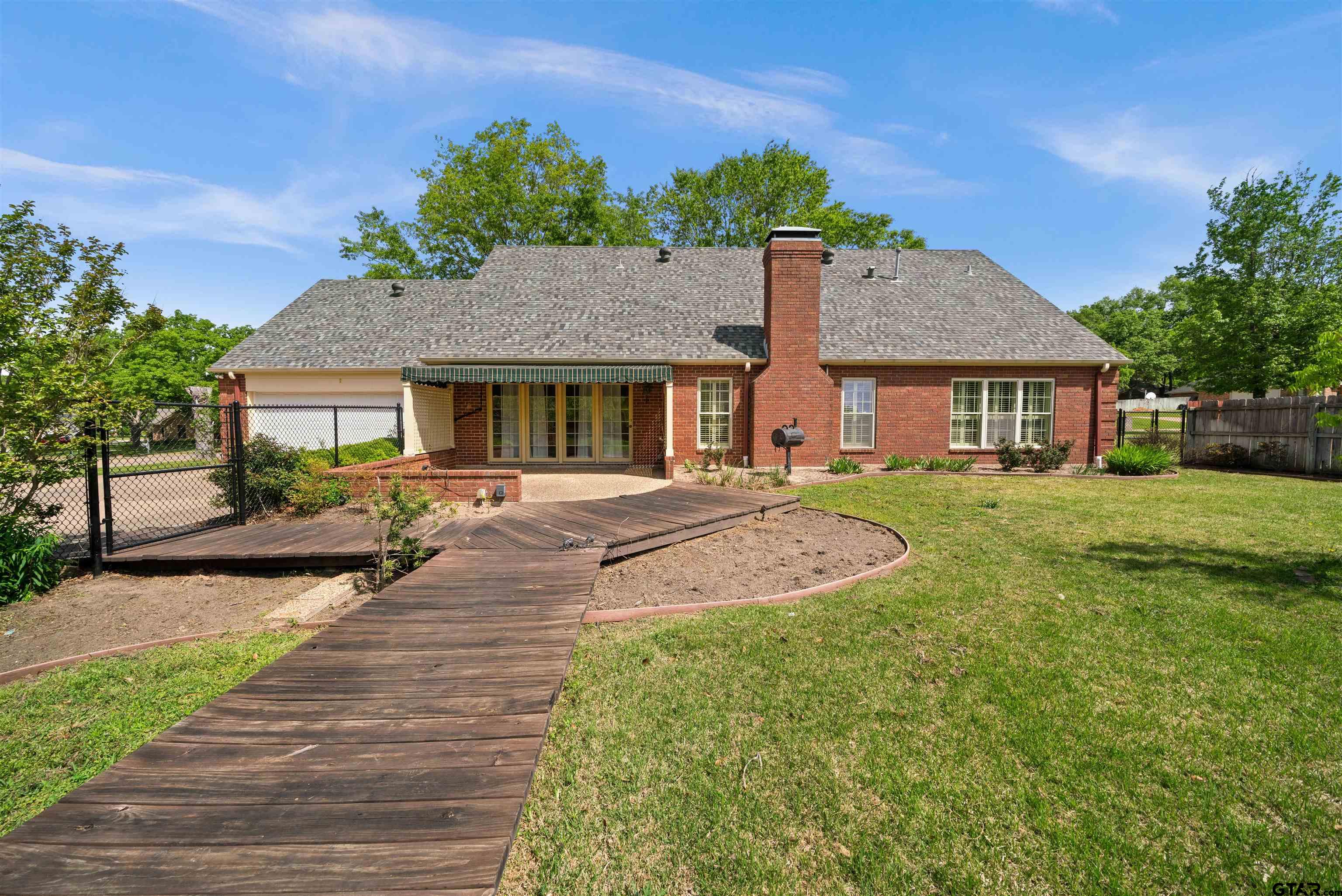 2103 Baylor Street Jacksonville, TX 75766 - Photo 6 of 45 a front view of a house with a yard