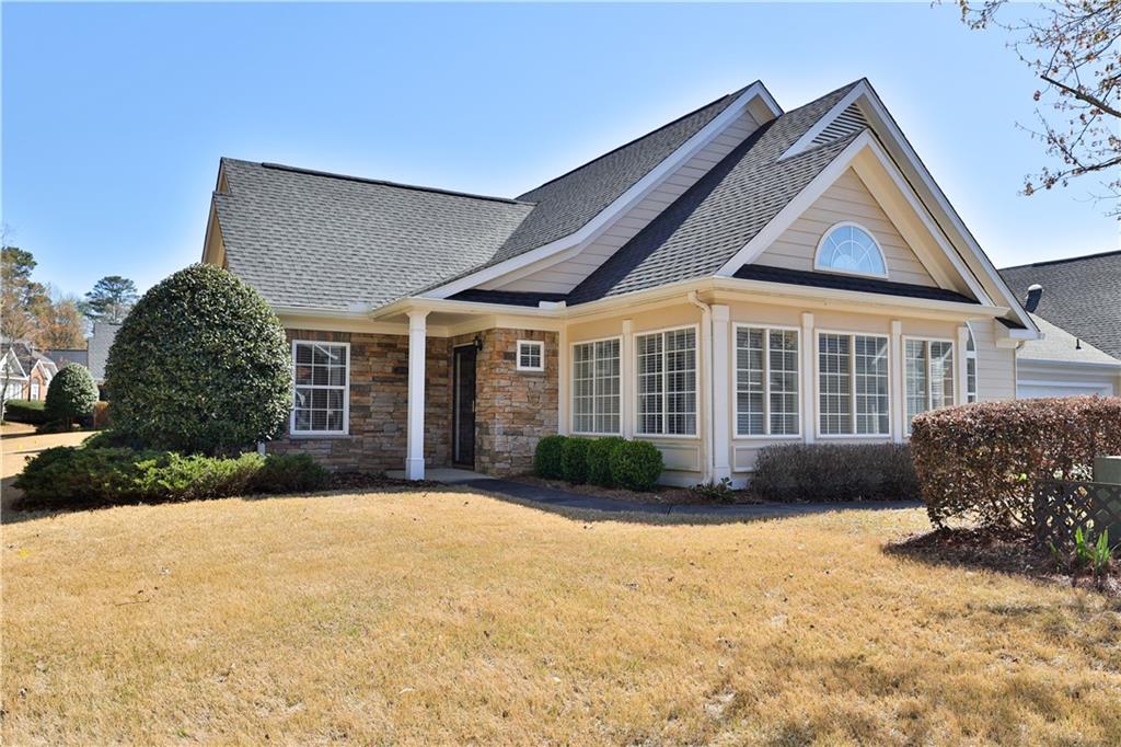 a front view of a house with a yard