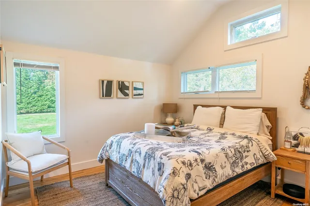 a bedroom with a bed and chair