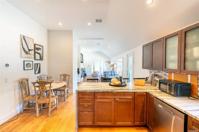 a kitchen with stainless steel appliances granite countertop a sink and cabinets