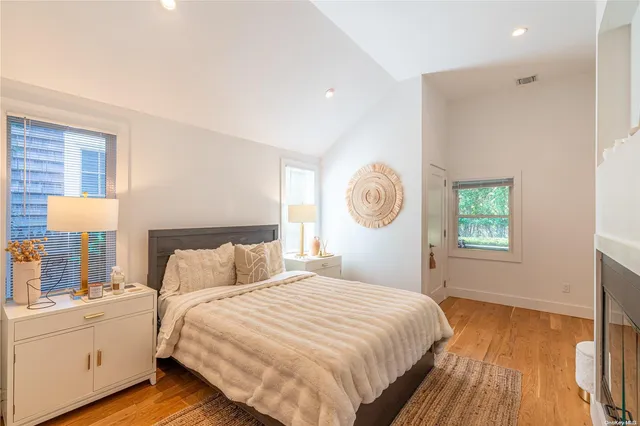 a bedroom with bed and window