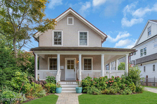 1204 5th Avenue Spring Lake, NJ 07762 - Photo 1 of 36 a front view of a house with a yard