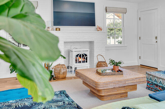 1204 5th Avenue Spring Lake, NJ 07762 - Photo 18 of 36 a living room with furniture and a potted plant