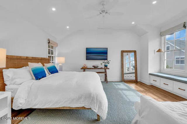 a bedroom with a bed and a couch