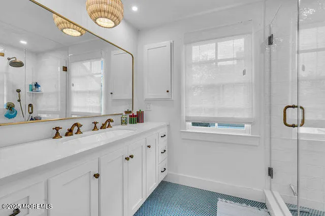 a bathroom with a sink mirror vanity and toilet
