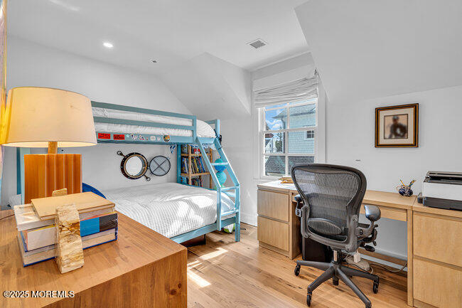 1204 5th Avenue Spring Lake, NJ 07762 - Photo 27 of 36 a bedroom with furniture and a wooden floor