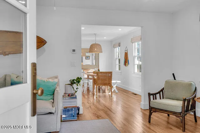 a view of a livingroom with furniture and wooden floor