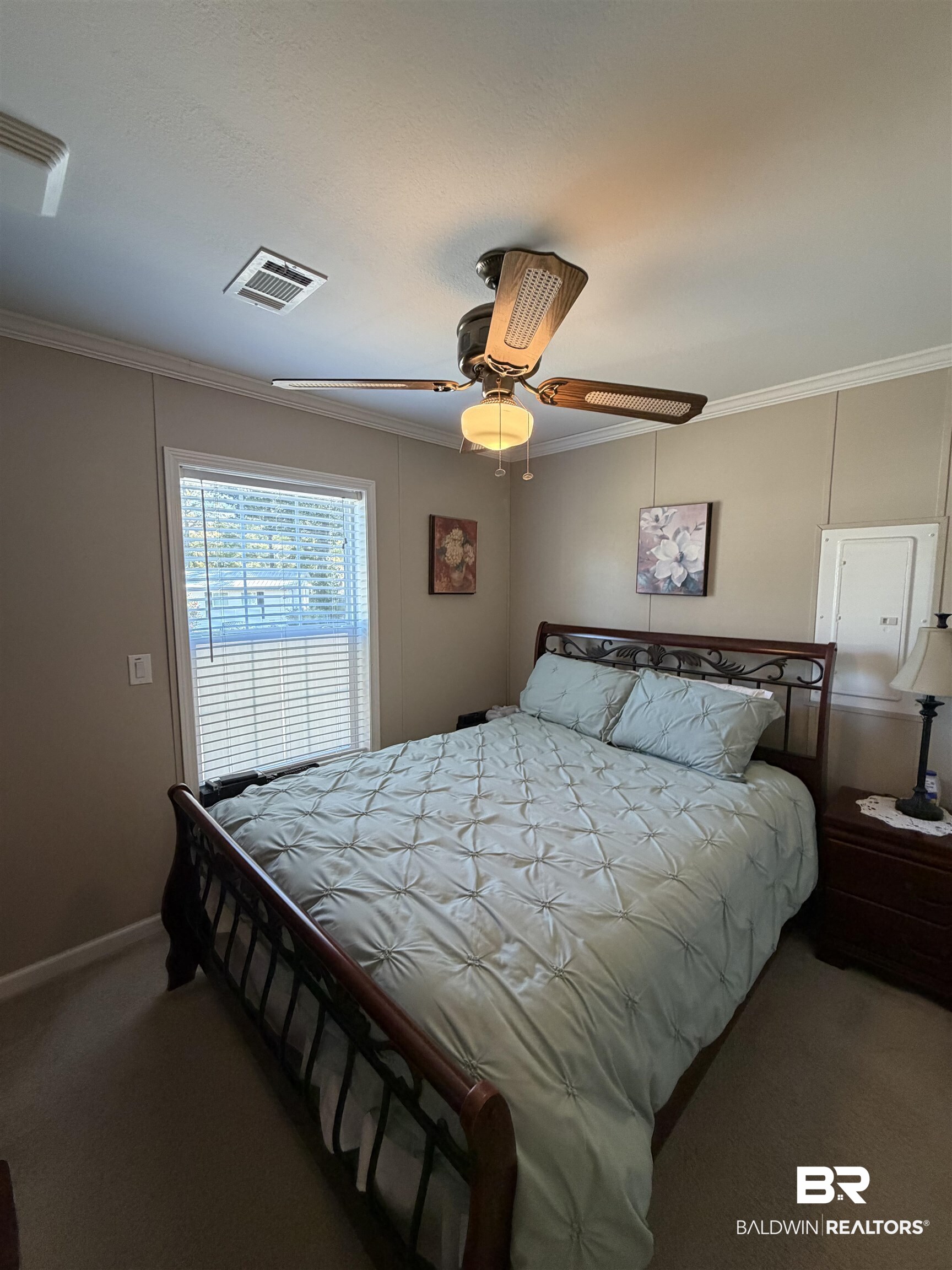 675 Escambia Loop Lillian, AL 36549 - Photo 17 of 44 Carpeted bedroom with ornamental molding and ceiling fan