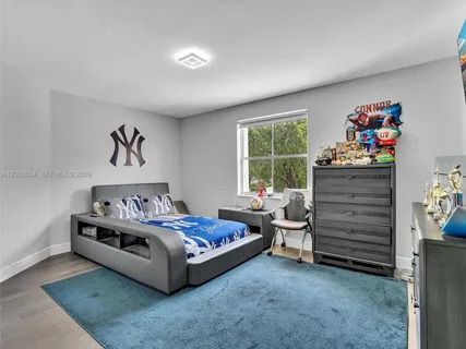 a bed room with a bed and a window