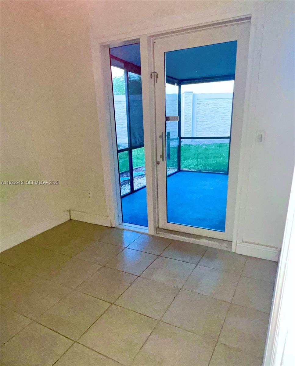 1701 Southwest 83rd Terrace Miramar, FL 33025 - Photo 11 of 18 a view of an empty room and window