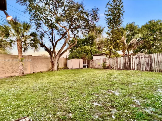 a fire hydrant in the middle of a field