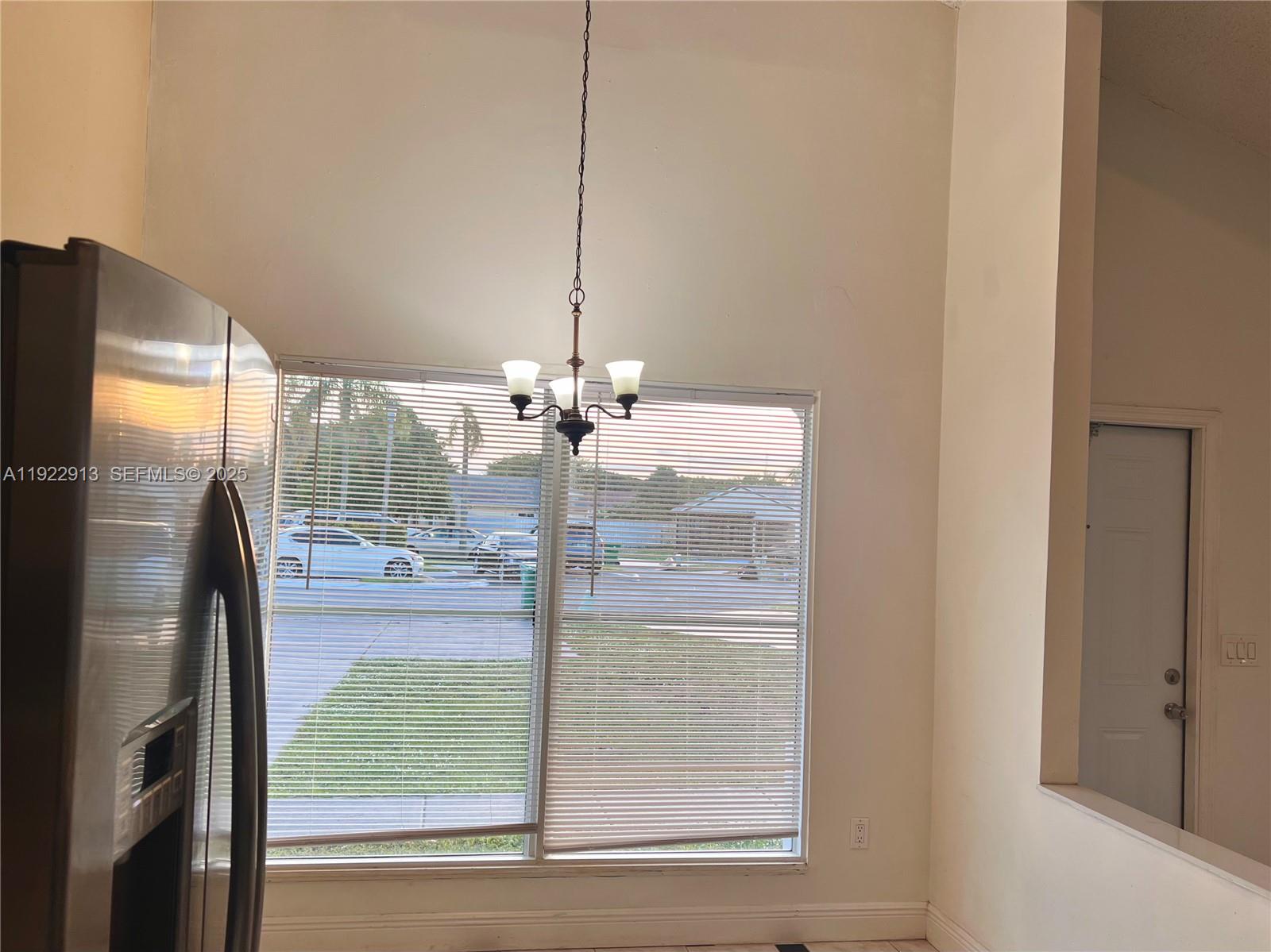 1701 Southwest 83rd Terrace Miramar, FL 33025 - Photo 3 of 18 a view of a room with a floor to ceiling window and an outdoor space