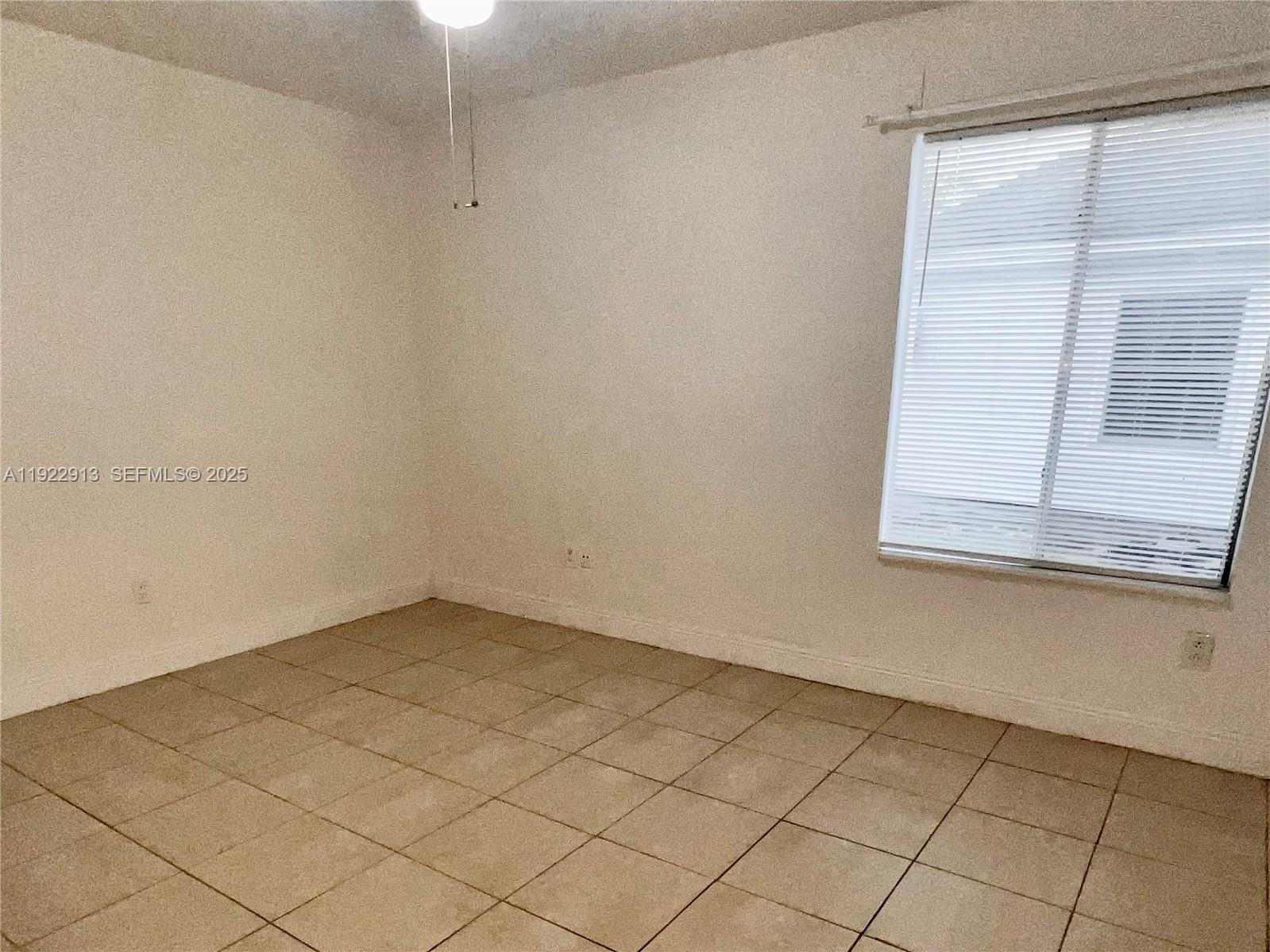 1701 Southwest 83rd Terrace Miramar, FL 33025 - Photo 5 of 18 a view of a small space with a window