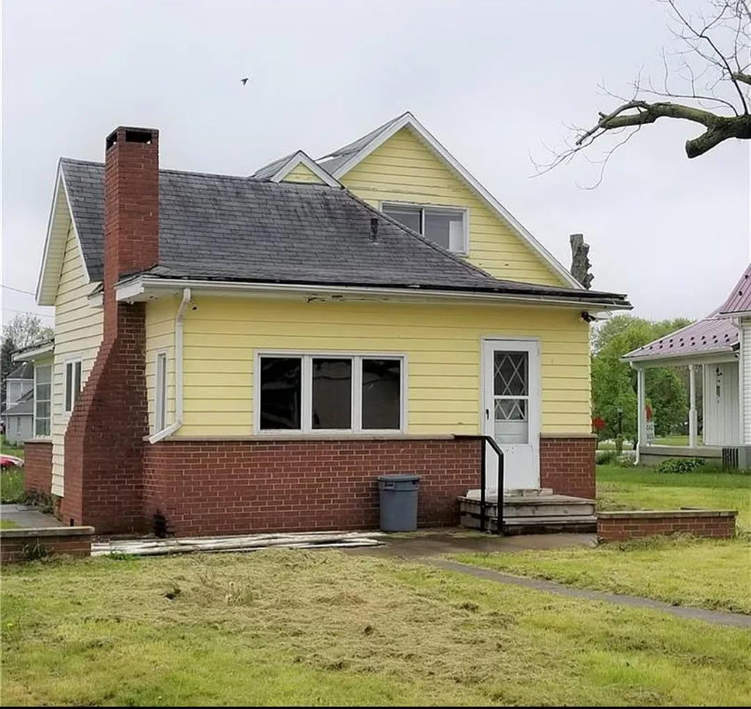 113 Cunningham Avenue Danville, IL 61832 - Photo 2 of 25 a house view with a garden space