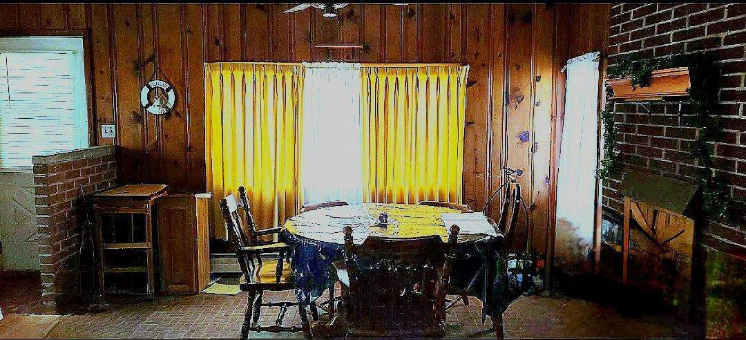 113 Cunningham Avenue Danville, IL 61832 - Photo 4 of 25 a view of a dining room with furniture and window
