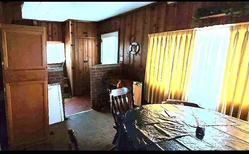 113 Cunningham Avenue Danville, IL 61832 - Photo 5 of 25 a bed sitting in a bedroom next to a window