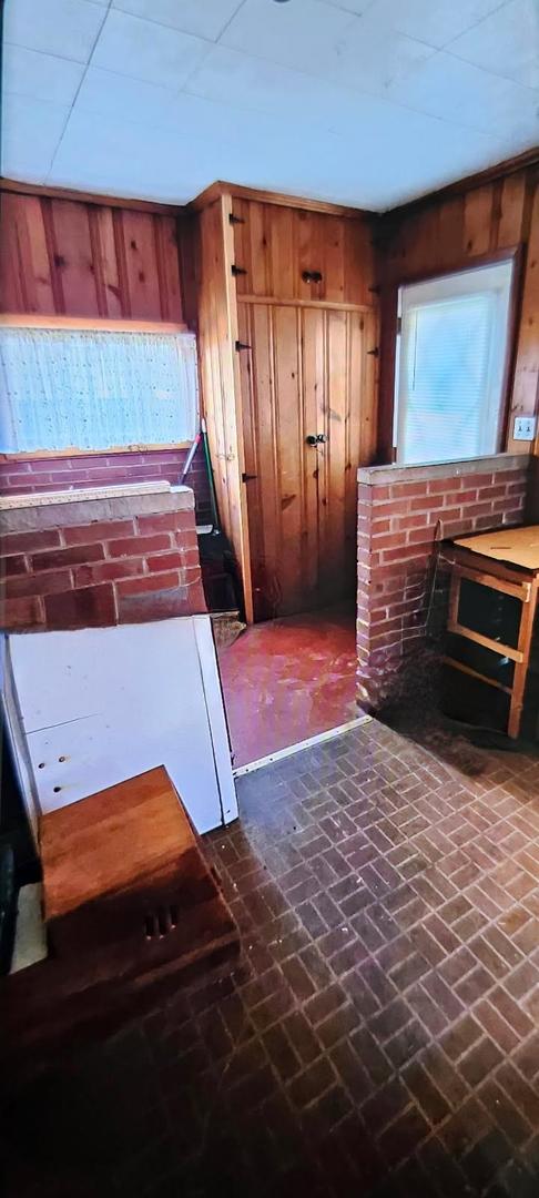 113 Cunningham Avenue Danville, IL 61832 - Photo 8 of 25 a living room with a bed and a flat screen tv