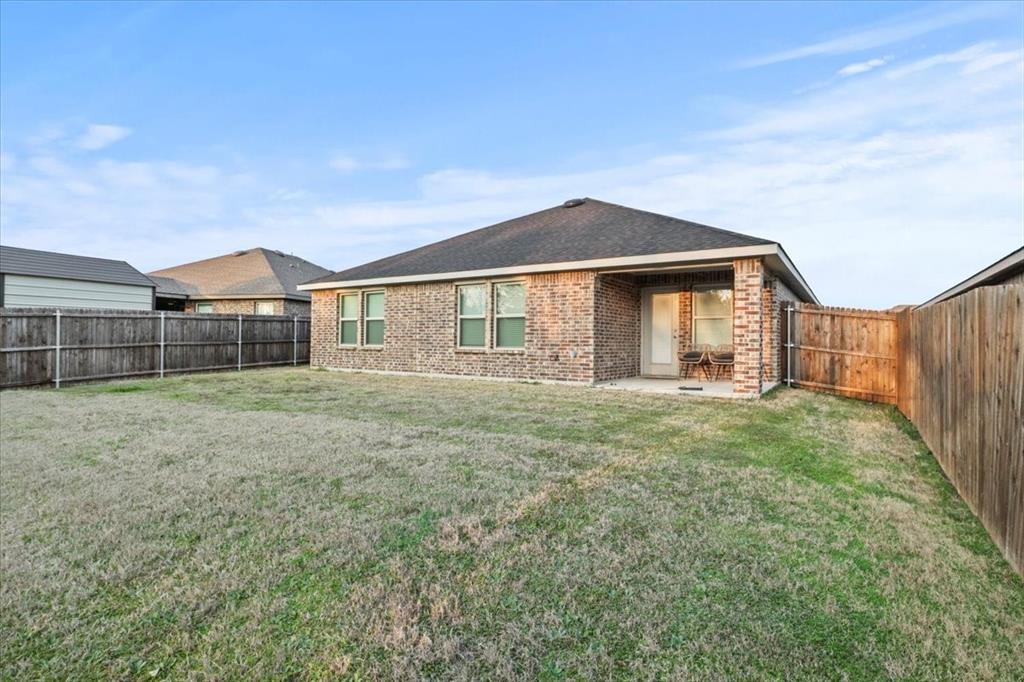 804 Roland Drive Fate, TX 75189 - Photo 26 of 27 a front view of a house with a yard