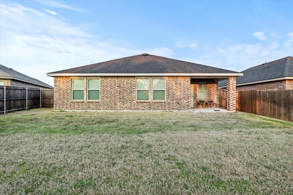 804 Roland Drive Fate, TX 75189 - Photo 27 of 27 a front view of a house with garden