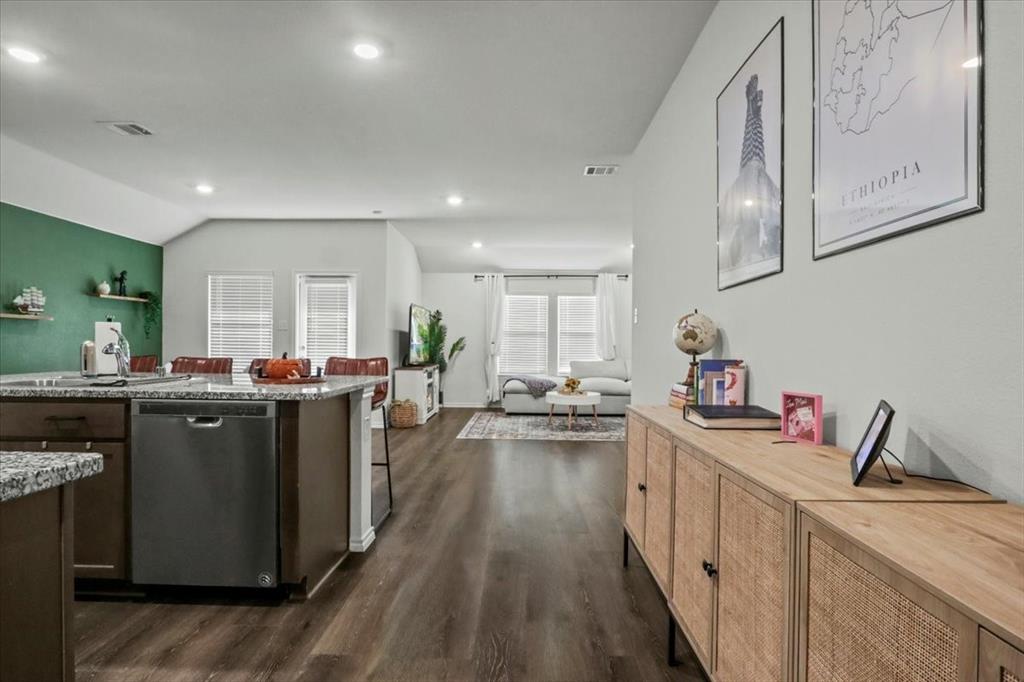 804 Roland Drive Fate, TX 75189 - Photo 3 of 27 a kitchen with sink a stove and cabinets