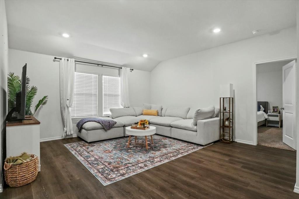 804 Roland Drive Fate, TX 75189 - Photo 6 of 27 a living room with furniture and wooden floor