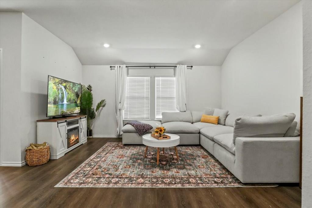 804 Roland Drive Fate, TX 75189 - Photo 7 of 27 a living room with furniture and a flat screen tv