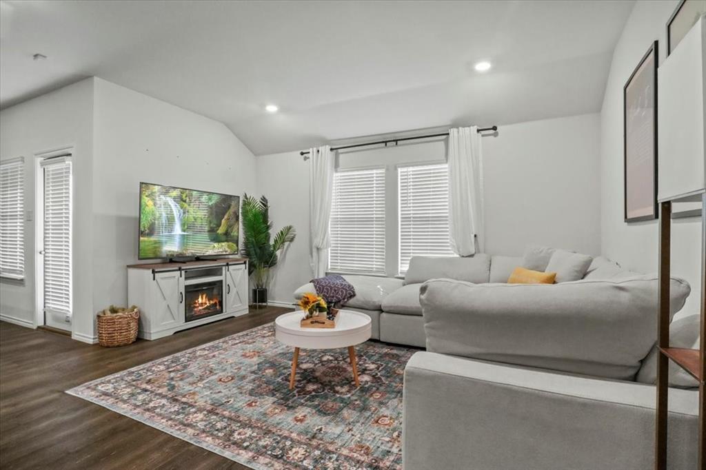 804 Roland Drive Fate, TX 75189 - Photo 8 of 27 a living room with furniture and a flat screen tv