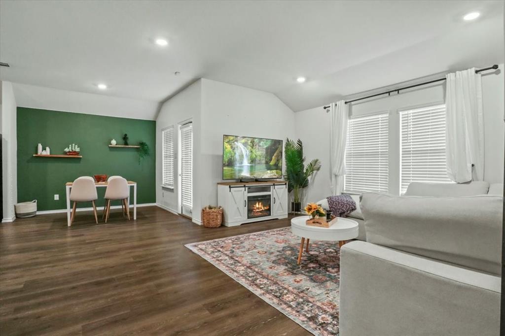 804 Roland Drive Fate, TX 75189 - Photo 9 of 27 a living room with furniture and a flat screen tv