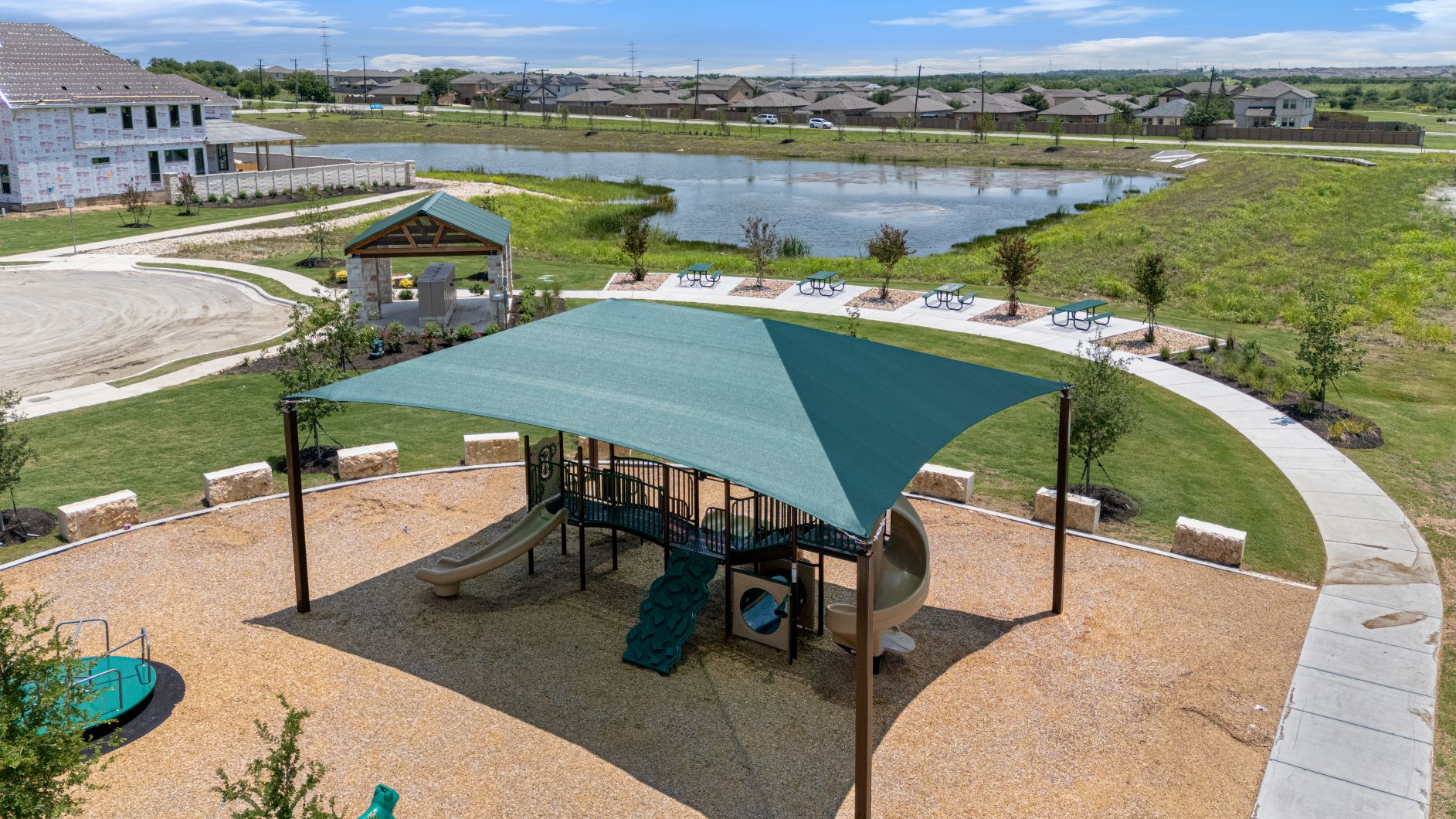 17200 Hope Bergman Road Pflugerville, TX 78660 - Photo 4 of 27 A community playground, complete with shade and a covered barbecue area, offers lakeside recreation.