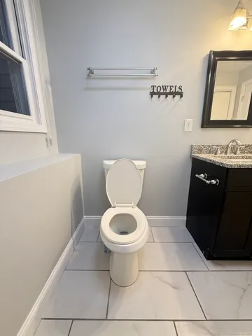 a bathroom with a toilet and a sink