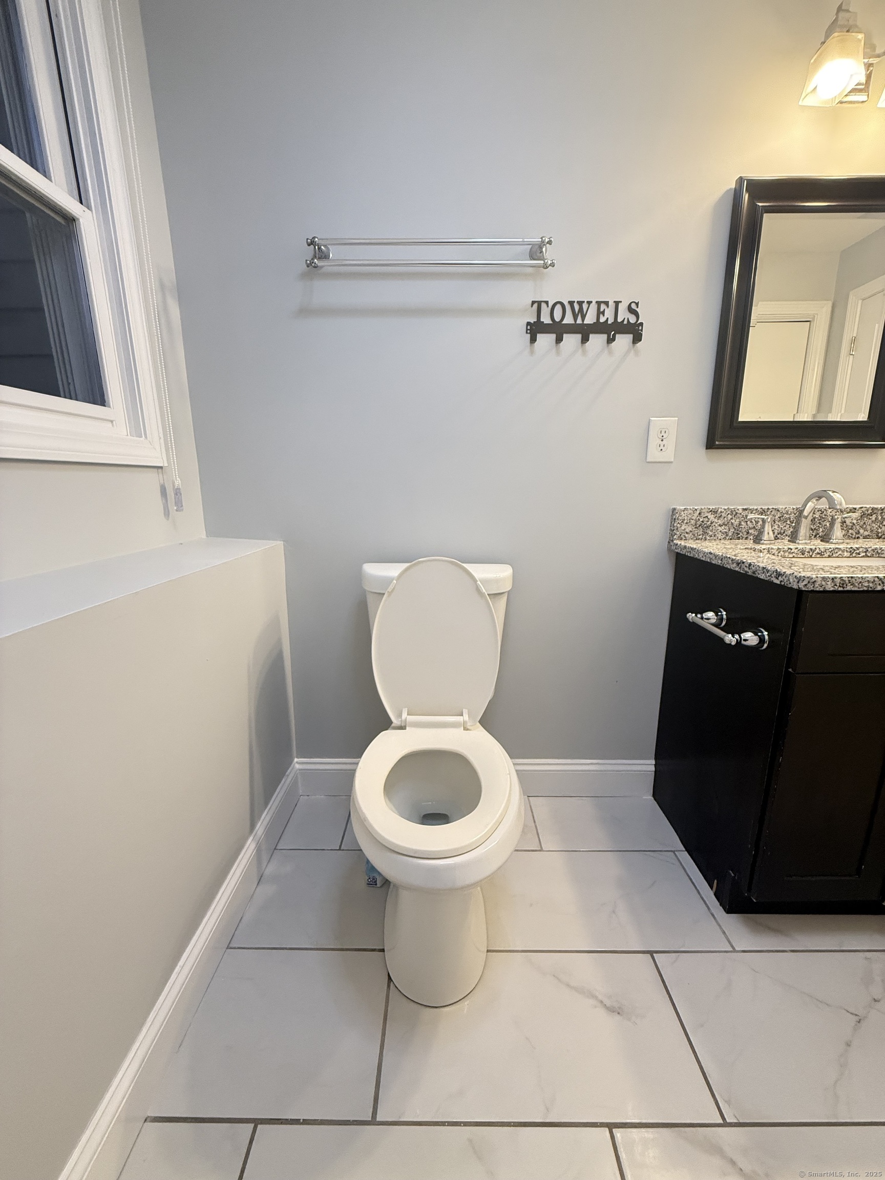 65 Muir Terrace, Unit 1 Southington, CT 06489 - Photo 16 of 24 a bathroom with a toilet and a sink