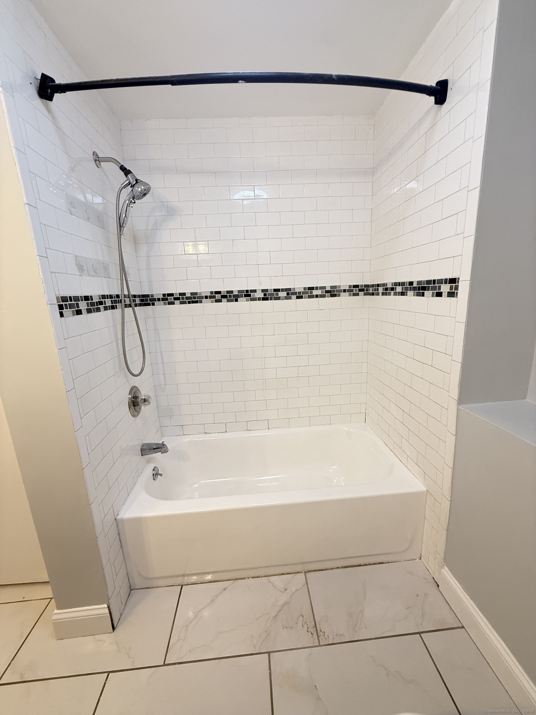 65 Muir Terrace, Unit 1 Southington, CT 06489 - Photo 17 of 24 a bathroom with a bath tub and a shower