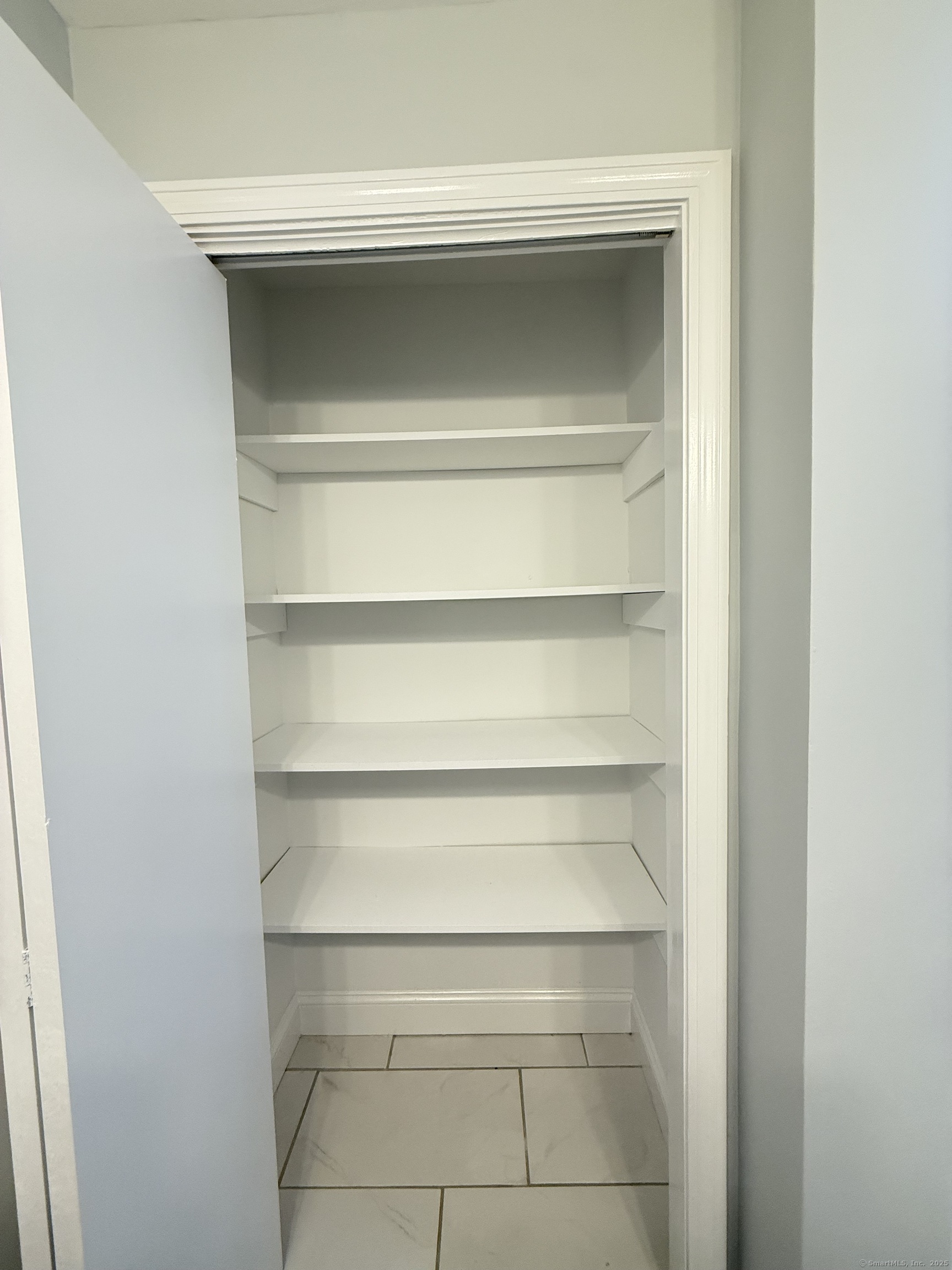 65 Muir Terrace, Unit 1 Southington, CT 06489 - Photo 18 of 24 a refrigerator in a kitchen