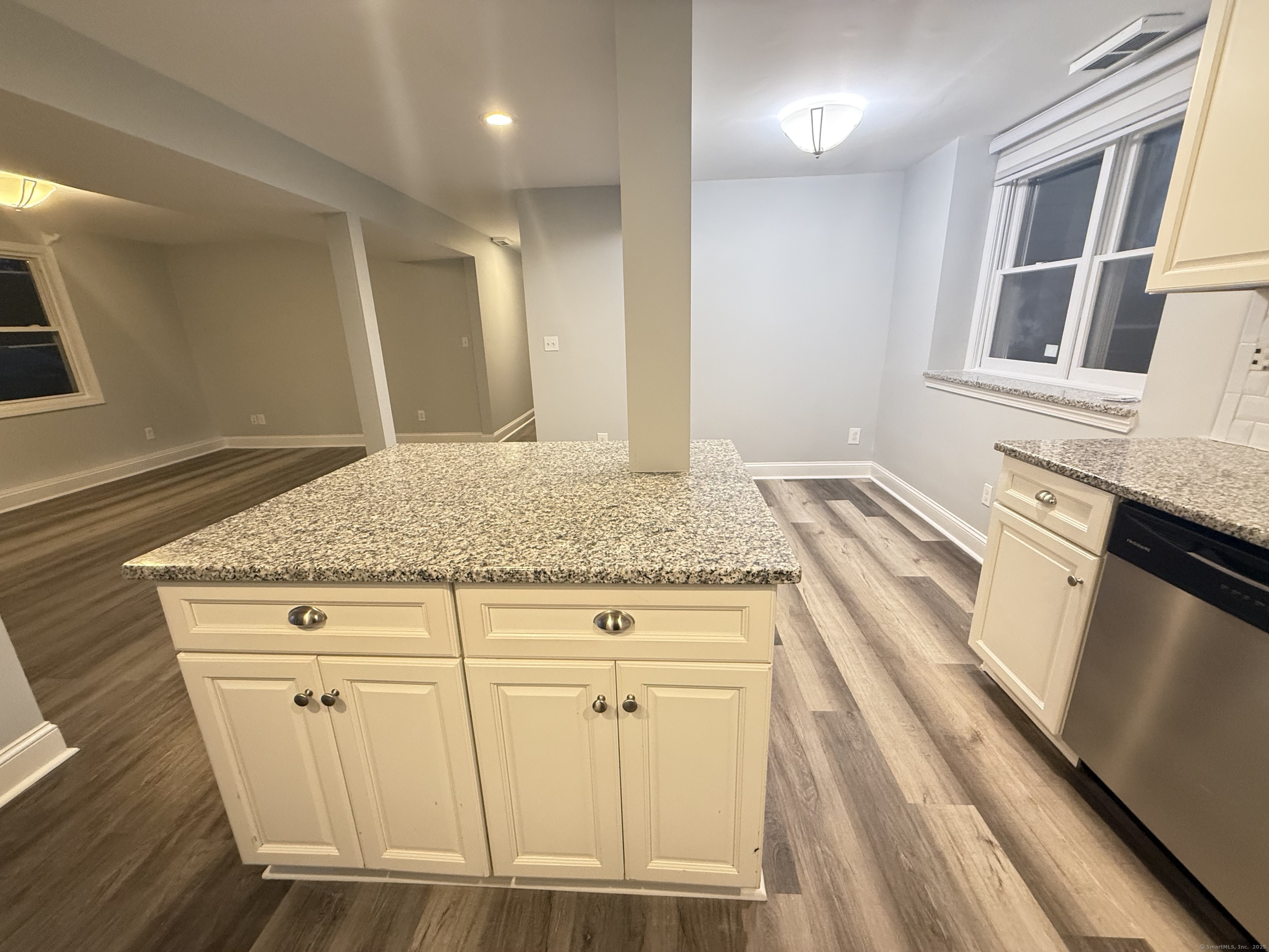 65 Muir Terrace, Unit 1 Southington, CT 06489 - Photo 8 of 24 a bathroom with a granite countertop sink and a mirror